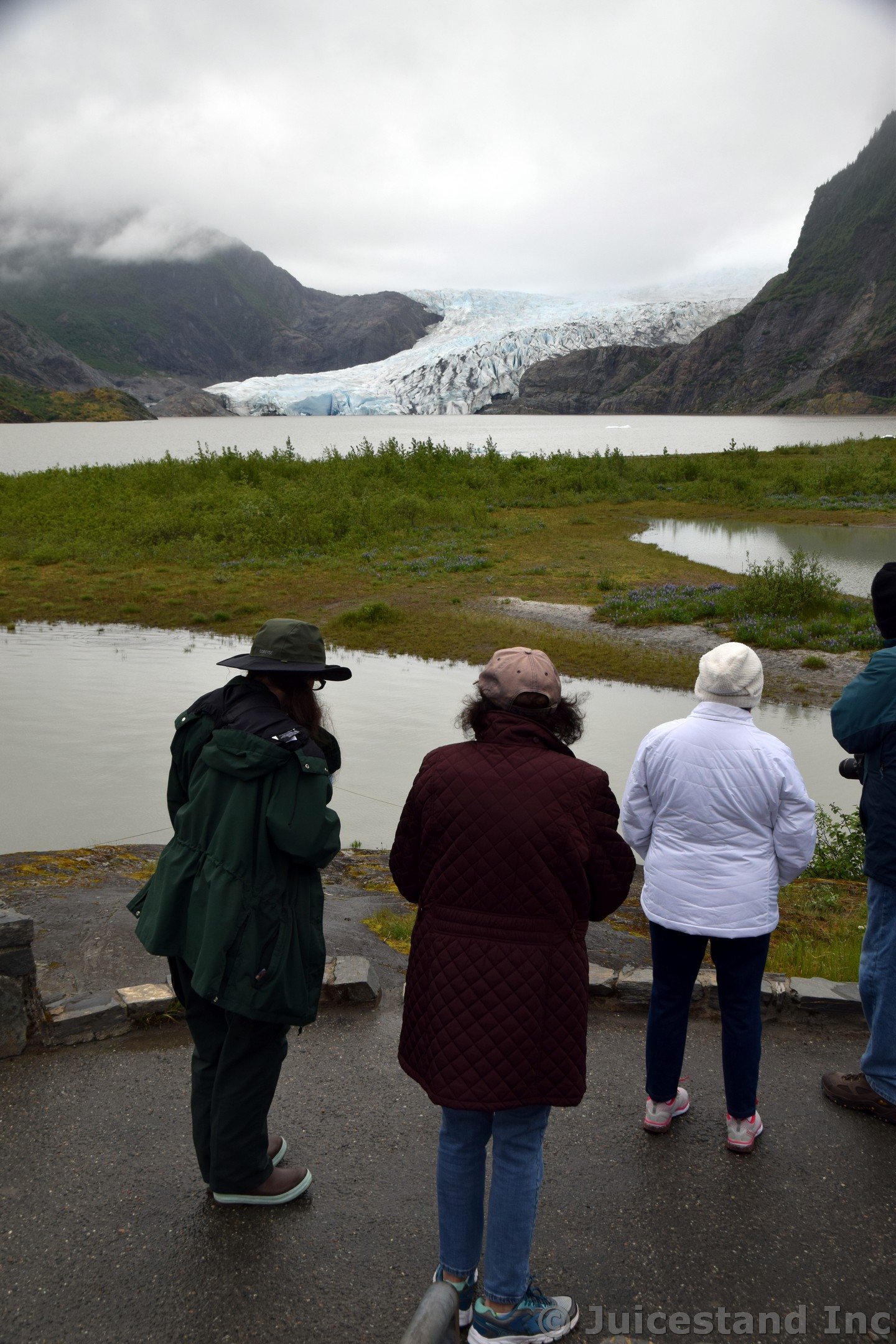 Visitors look at Mendenhall Glacier in Juneau