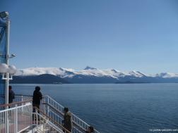 Alaskan moutains and cruise ship in the distance as viewed from NCL Pearl.jpg
